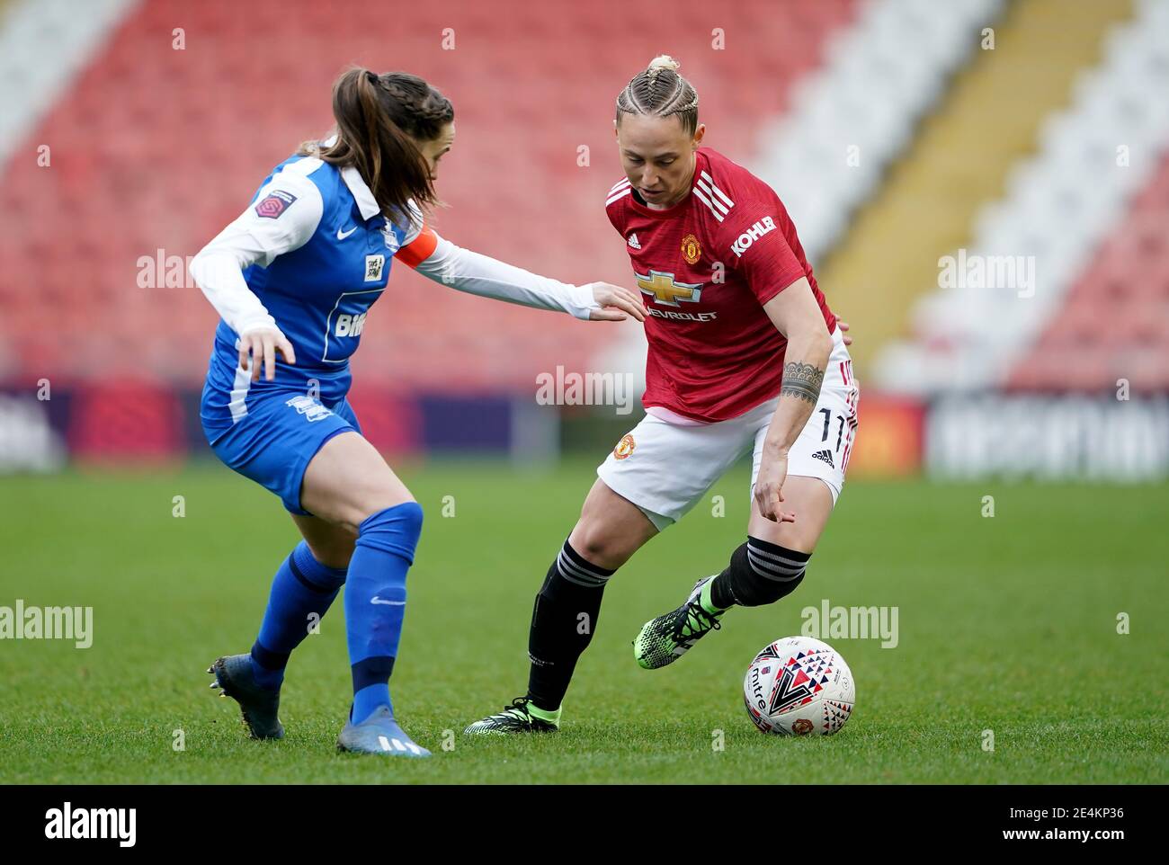 Birmingham City's Harriet Scott (left) and Manchester United's Leah Galton battle for the ball during the FA Women's Super League match at Leigh Sports Village Stadium, Manchester. Picture date: Sunday January 24, 2021. Stock Photo