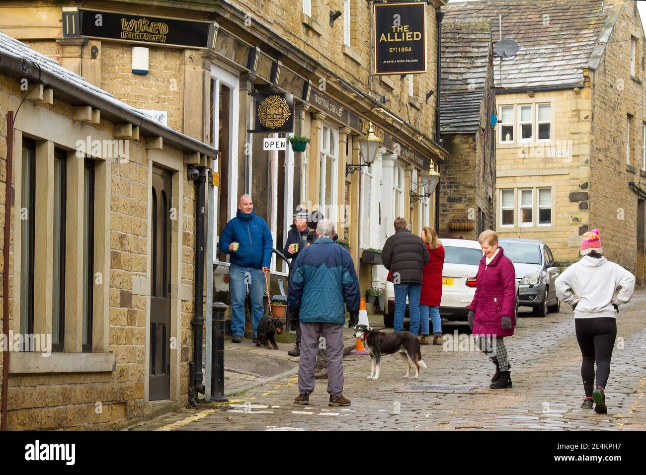 Honley Honley, Huddersfield, Yorkshire, UK, 24 January 2021. Queueing for ...