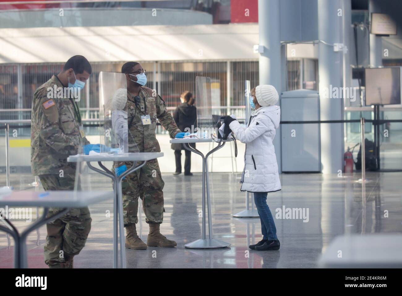 New York, USA. 23rd Jan, 2021. National Guard members assist people at a COVID-19 vaccination center at the Jacob K. Javits Convention Center in New York, the United States, Jan. 23, 2021. The total number of confirmed COVID-19 cases in the United States topped 24.99 million, according to the data released by Johns Hopkins University on Saturday. Credit: Michael Nagle/Xinhua/Alamy Live News Stock Photo