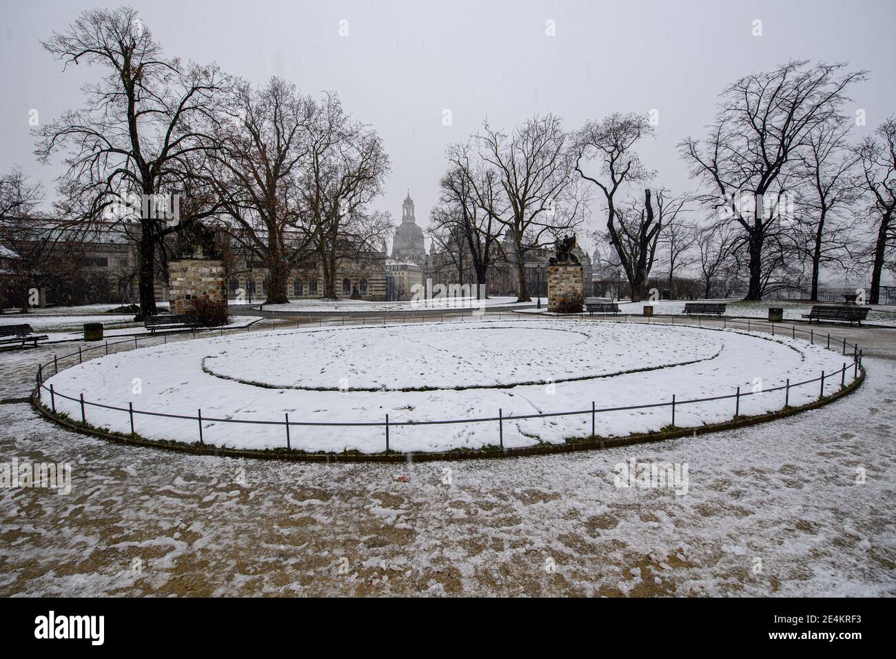 24 January 2021, Saxony, Dresden: Snow rain falls on Sunday at noon at the Brühlsche Terrasse with the Albertinum (l-r), the Frauenkirche, the Lipsius Building, the Academy of Fine Arts and the Hofkirche. Photo: Robert Michael/dpa-Zentralbild/dpa Stock Photo