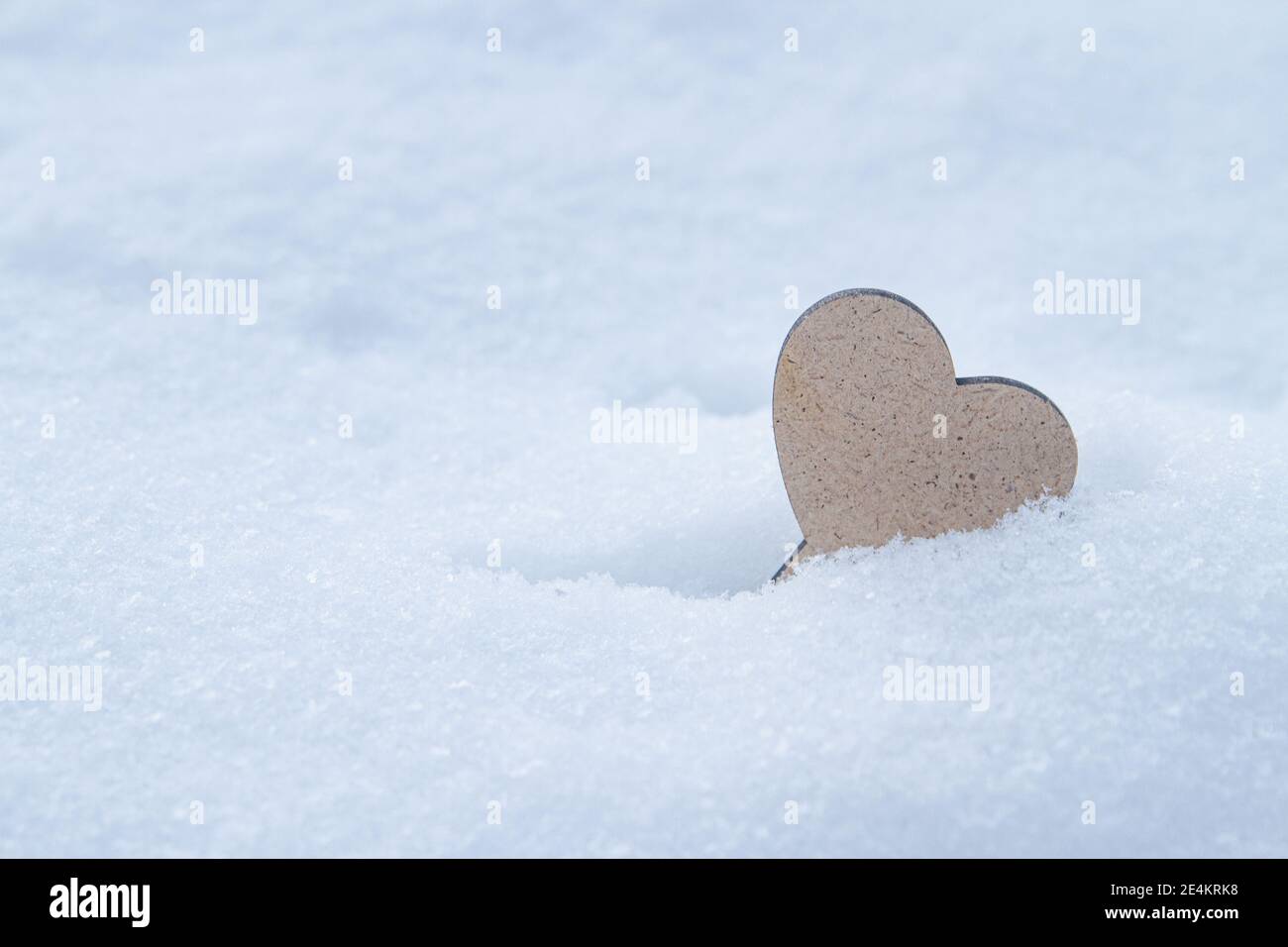Single heart on snow background. St. Valentine's Day. Stock Photo