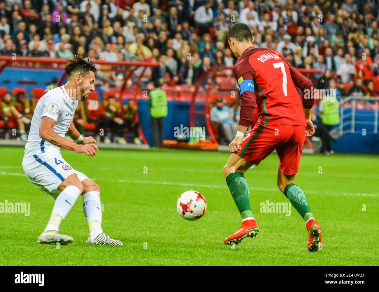 Kazan, Russia – June 28, 2017. Portugal national football team captain Cristiano Ronaldo against Chile midfielder Mauricio Isla during FIFA Confederat Stock Photo
