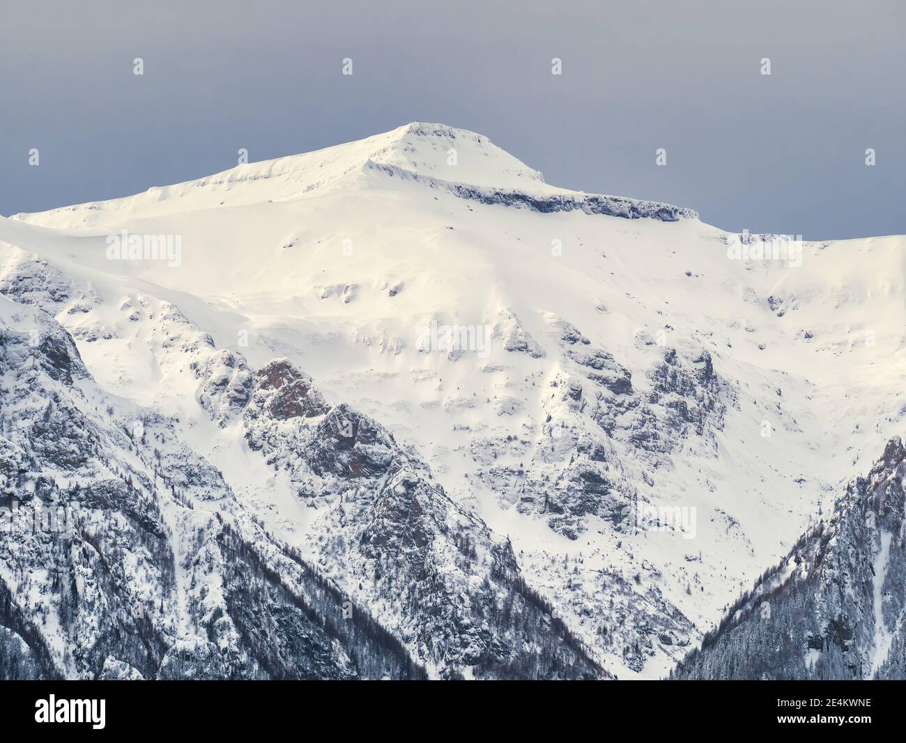 Winter landscape with mountain peaks covered in snow. Beautiful view ...