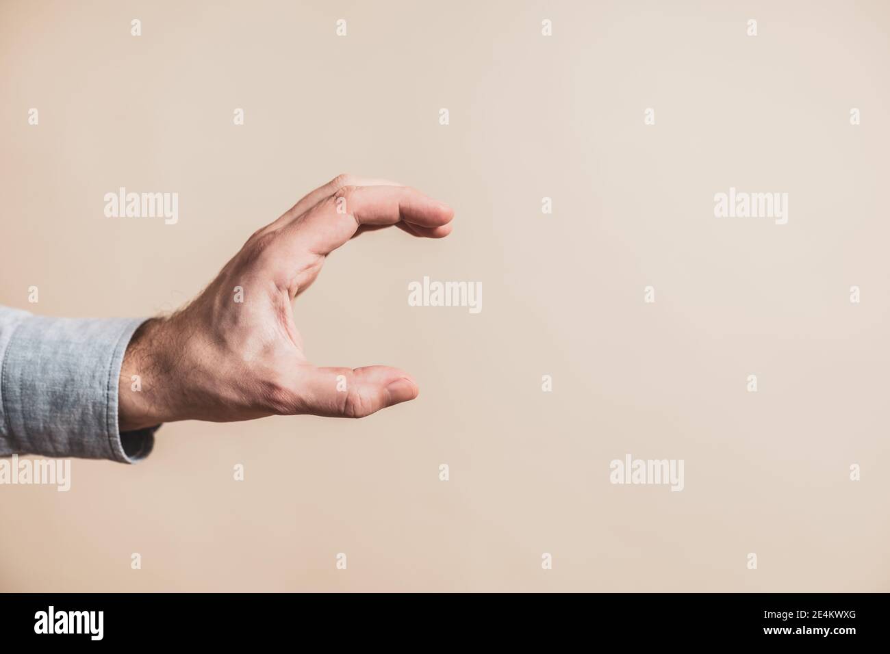 Gripping male hand gesture hi-res stock photography and images - Alamy