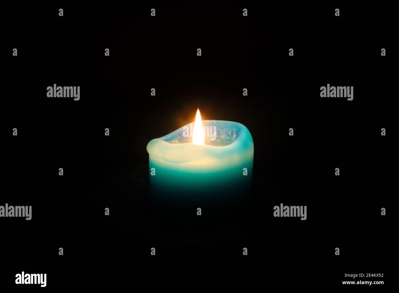 Cape Town South Africa 08022020 Bright blue candle glowing in a dark