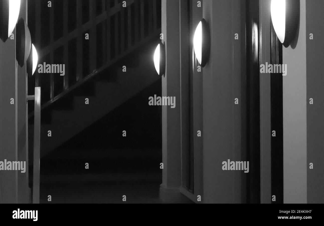 Cape Town  South Africa- 07-03-2020 Creative black and white shot of bright shining hallway lights leading to staircase. Stock Photo
