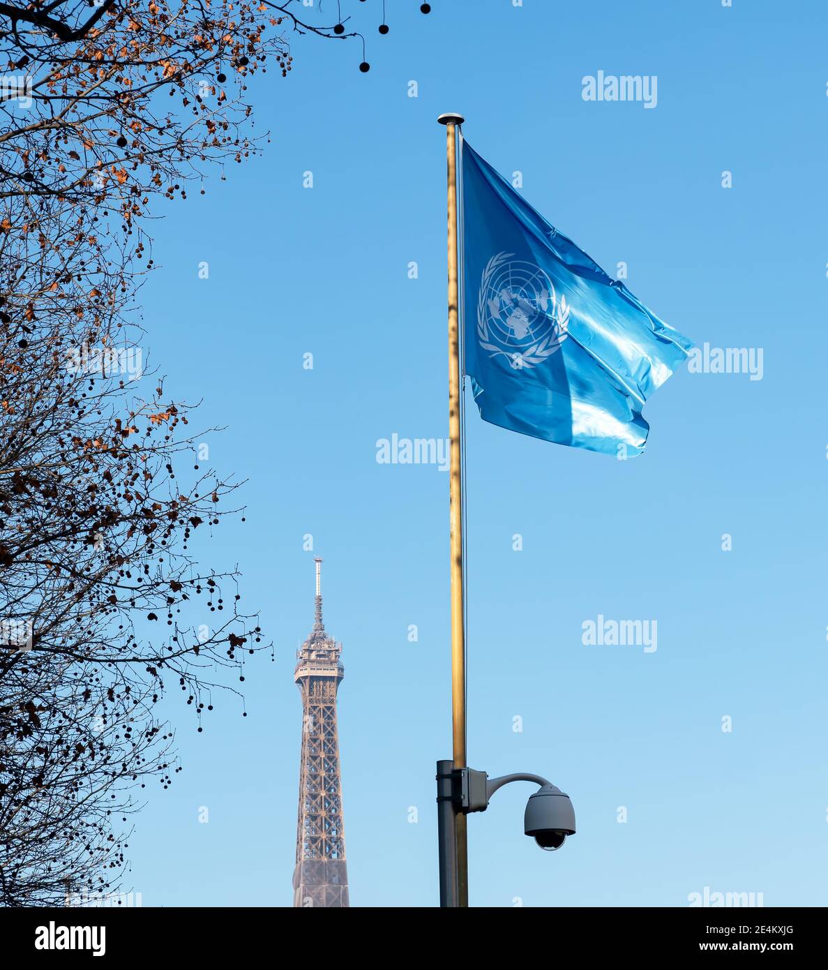 Waving united nations UN flag with Eiffel Tower - Paris, France Stock Photo