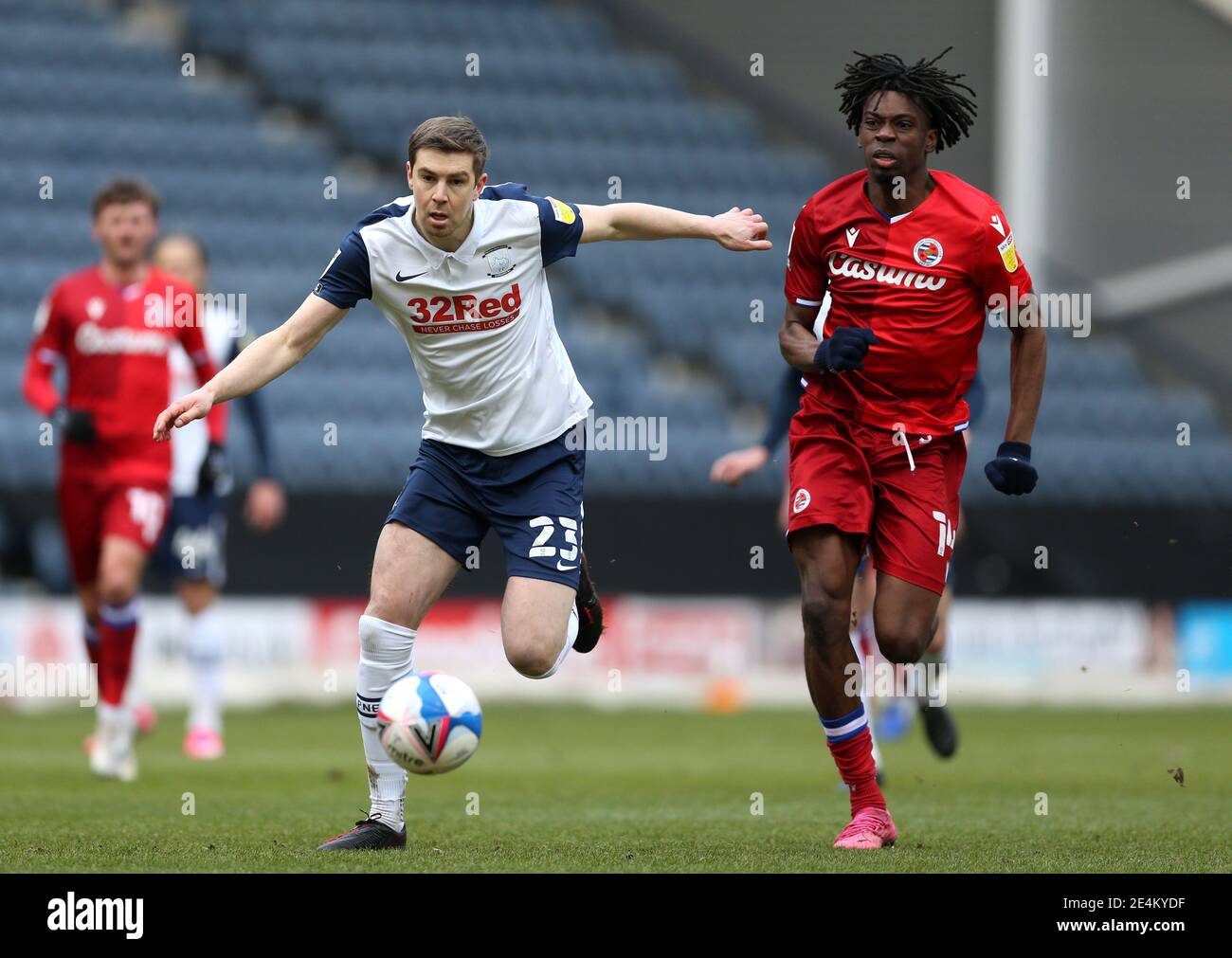 Preston North End's Paul Huntington (left) and Reading's Ovie Ejaria (right) battle for the ball during the Sky Bet Championship match at Deepdale, Preston. Picture date: Sunday January 24, 2021. Stock Photo