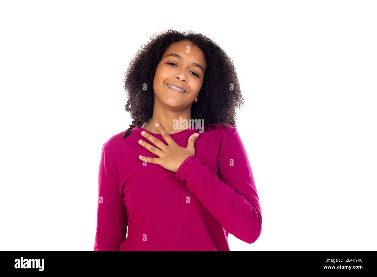 Beautiful teenager girl with pink sweater isolated on a white