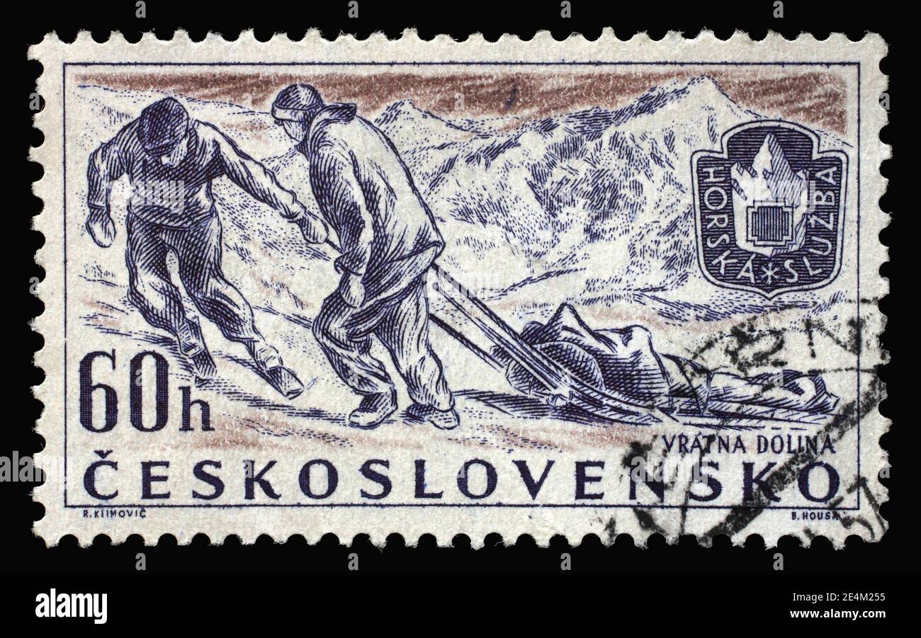 Stamp printed in Czechoslovakia shows Mountain Climbing Rescue Service, Sports 1957 series, circa 1957 Stock Photo