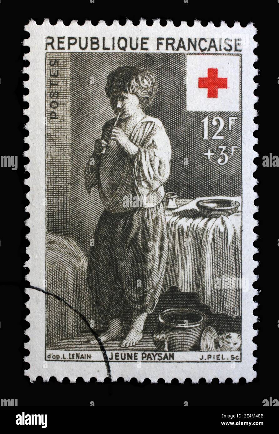 Stamp printed in the France shows Young peasant, Painting by Le Nain, Series: Red Cross, circa 1956 Stock Photo