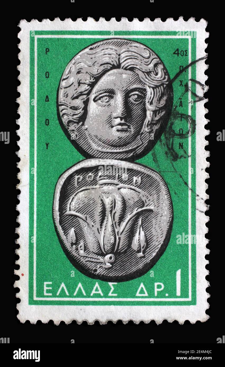 Stamp printed in Greece shows Helios (Sun) and Rose, Rhodes, 4th cent. B.C., Ancient Greek Coins, circa 1963 Stock Photo