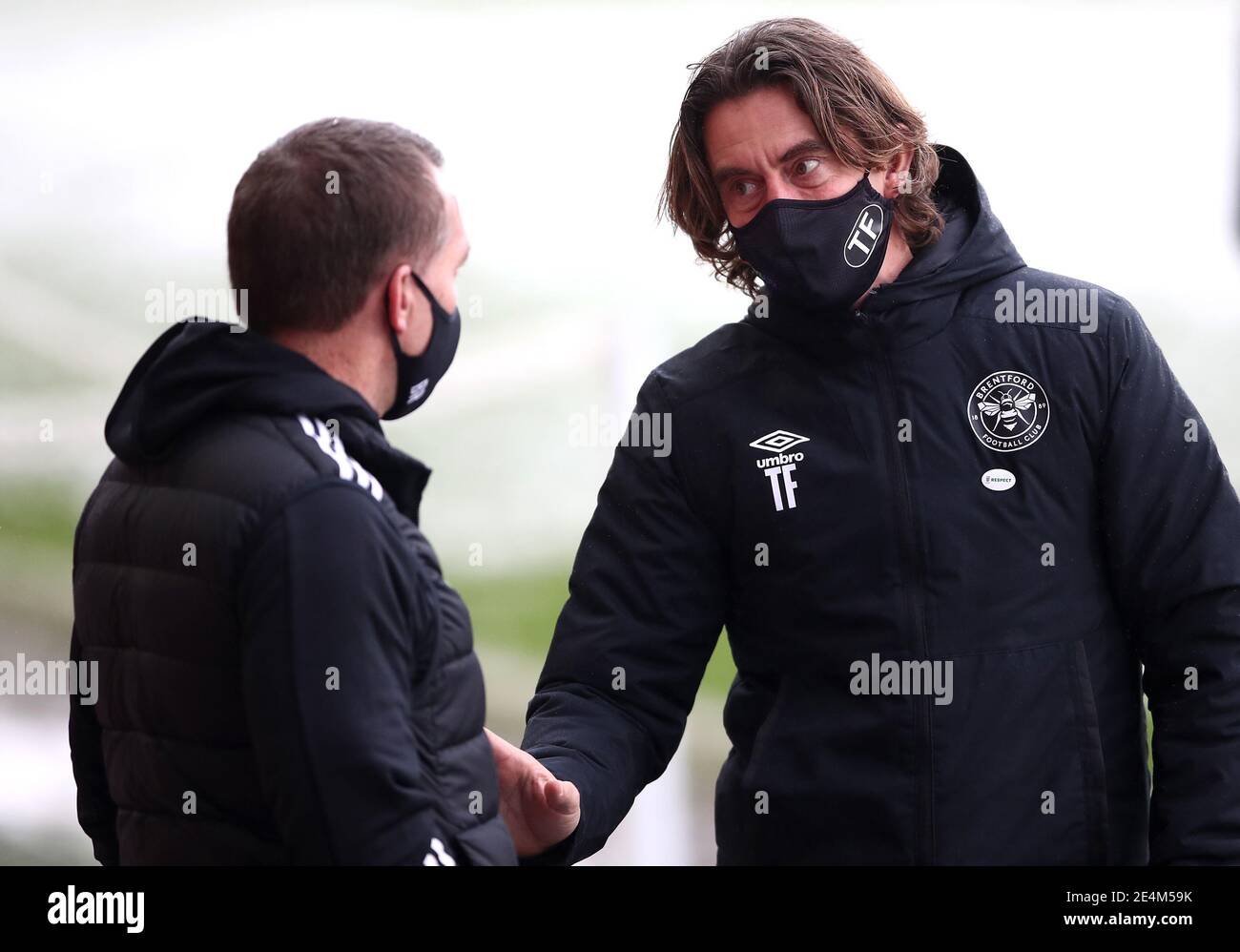 Leicester City manager Brendan Rodgers (left) and Brentford manager Thomas Frank in discussion before the Emirates FA Cup fourth round match at the Brentford Community Stadium, London. Picture date: Sunday January 24, 2021. Stock Photo