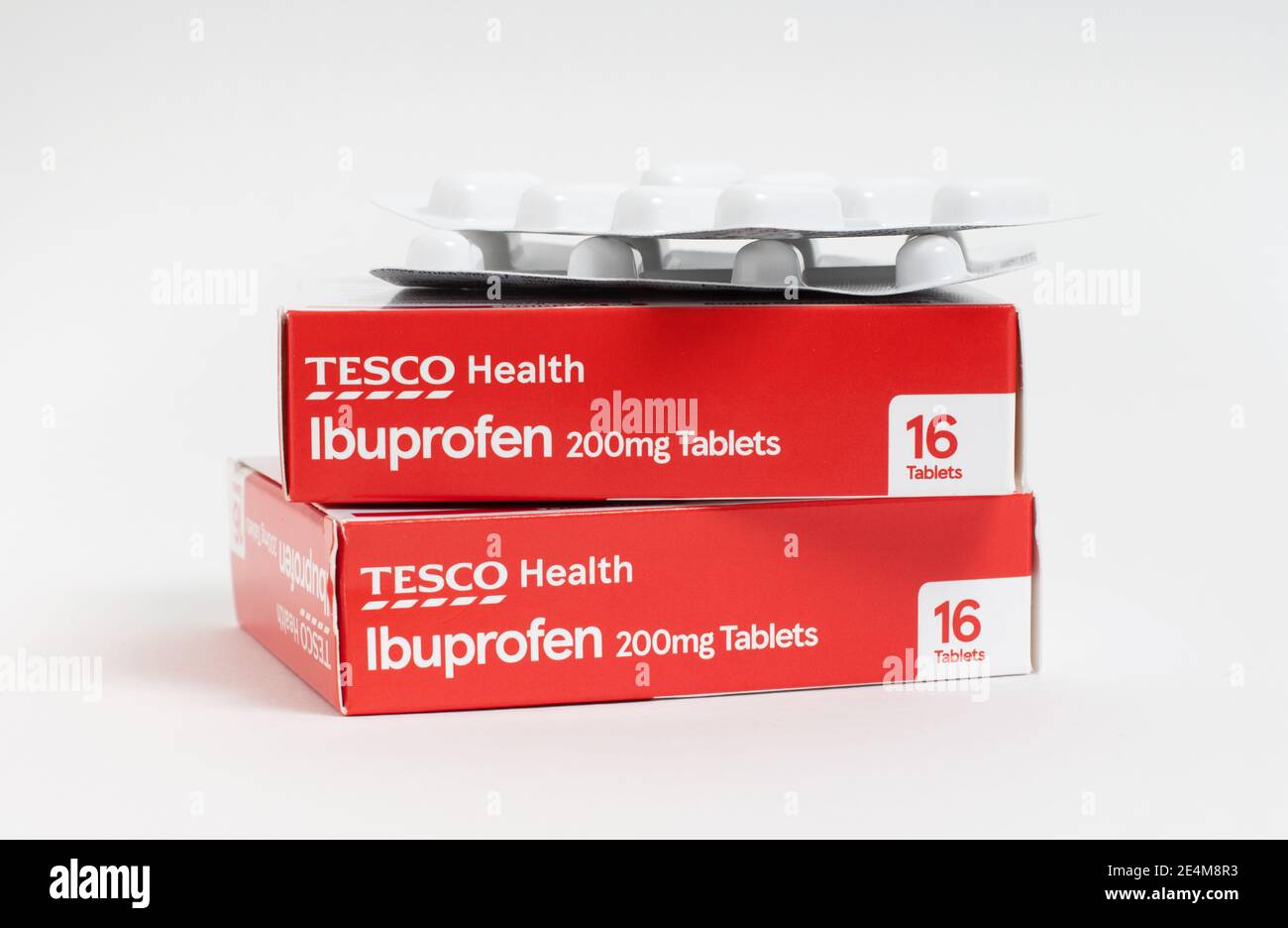 London / UK - January 23rd 2021 - Ibuprofen packets from Tesco supermarket, stacked against a white background Stock Photo