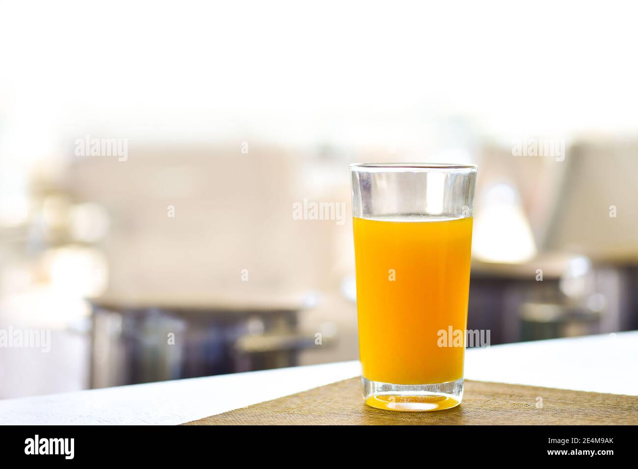 Fresh orange juice in a glass on the table Stock Photo - Alamy