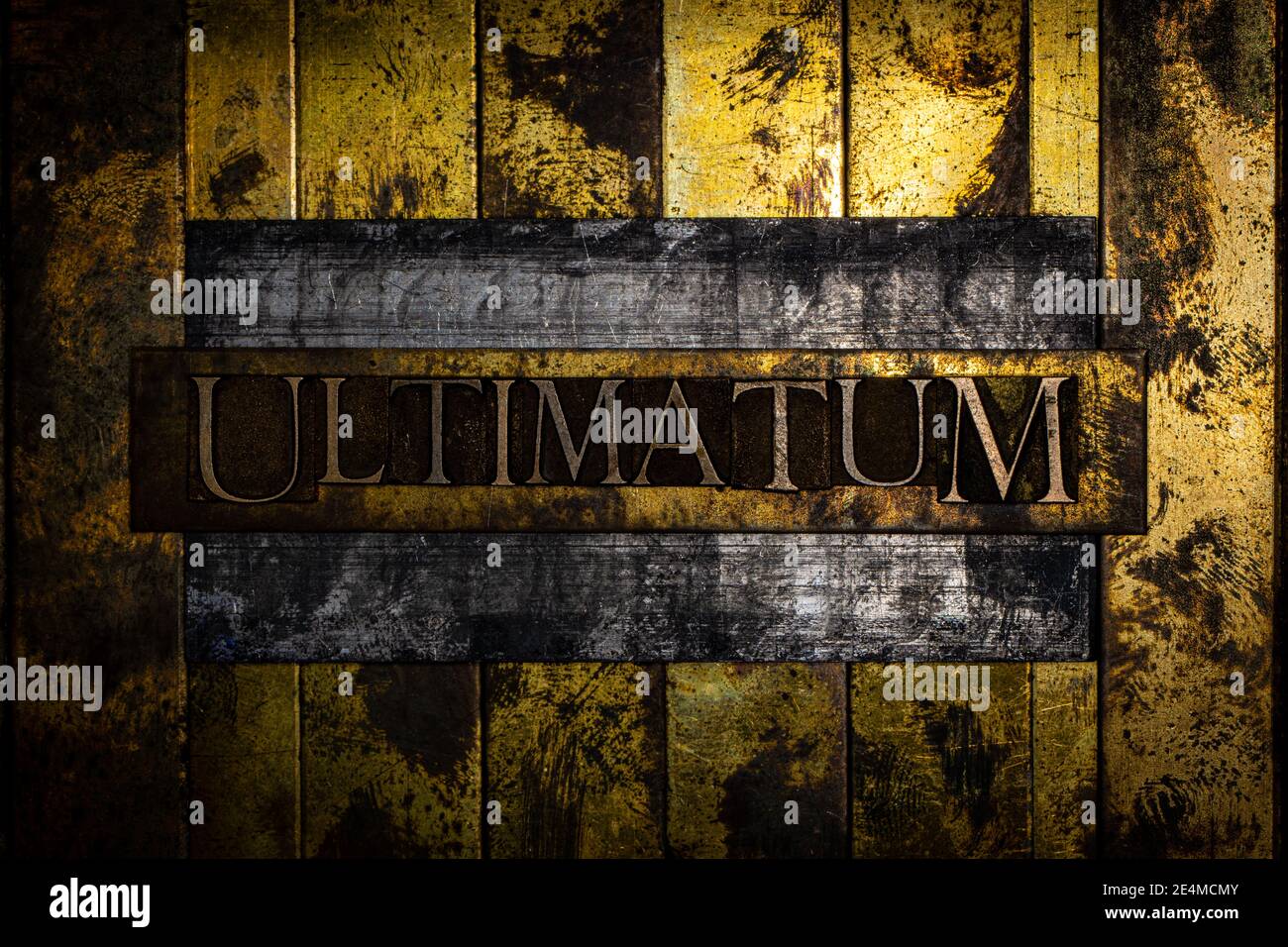 Ultimatum text on vintage textured grunge copper and gold background Stock Photo
