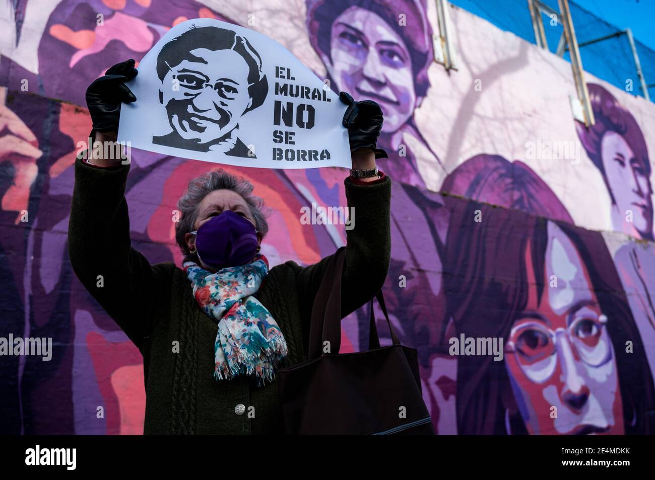 A woman holds a placard with the picture of Rosa Parks and the words 'the mural should not be erased', during a protest against the removal proposed by far-right party VOX of a feminist mural named 'Union makes force'. In the mural appear the faces of 15 women who are part of history for their fight in favor of equality: Angela Davis, Frida Kahlo, Nina Simone, Rigoberta Menchu, Lucia Sanchez Saornil, Rosa Arauzo, Valentina Tereshkova, Chimamanda Ngozi, Emma Goldman, Kanno Sugato, Liudmila Pavlichenko, Billy Jean King, Gata Cattana, Rosa Parks, and Comandanta Ramona. Stock Photo