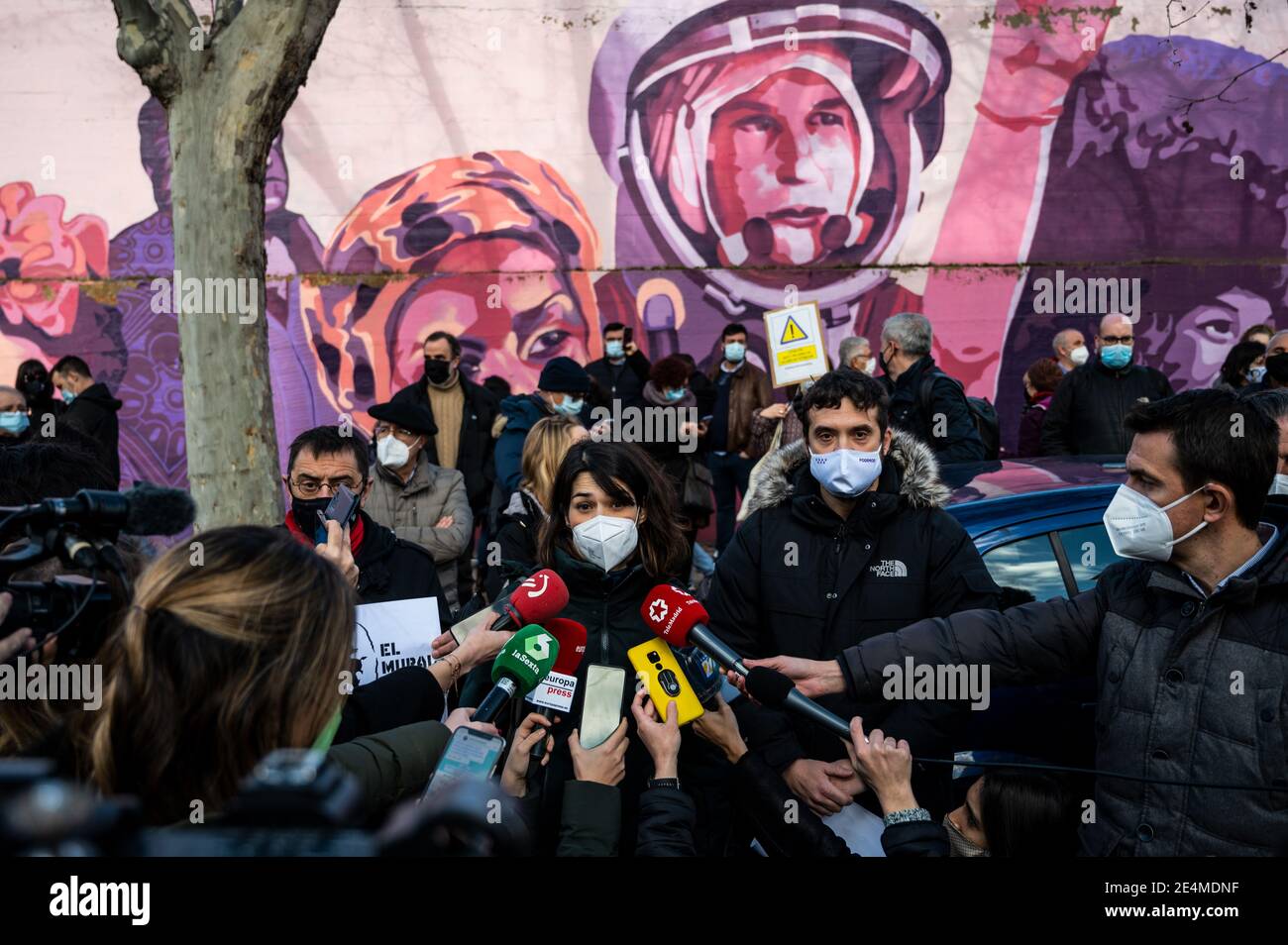 Madrid, Spain. 24th Jan, 2021. Isabel Serra, member of Podemos party speaks to the press during a protest against the removal proposed by far-right party VOX of a feminist mural named 'Union makes force'. In the mural appear the faces of 15 women who are part of history for their fight in favor of equality: Angela Davis, Frida Kahlo, Nina Simone, Rigoberta Menchu, Lucia Sanchez Saornil, Rosa Arauzo, Valentina Tereshkova, Chimamanda Ngozi, Emma Goldman, Kanno Sugato, Liudmila Pavlichenko, Billy Jean King, Gata Cattana, Rosa Parks, and Comandanta Ramona. Credit: Marcos del Mazo/Alamy Live News Stock Photo