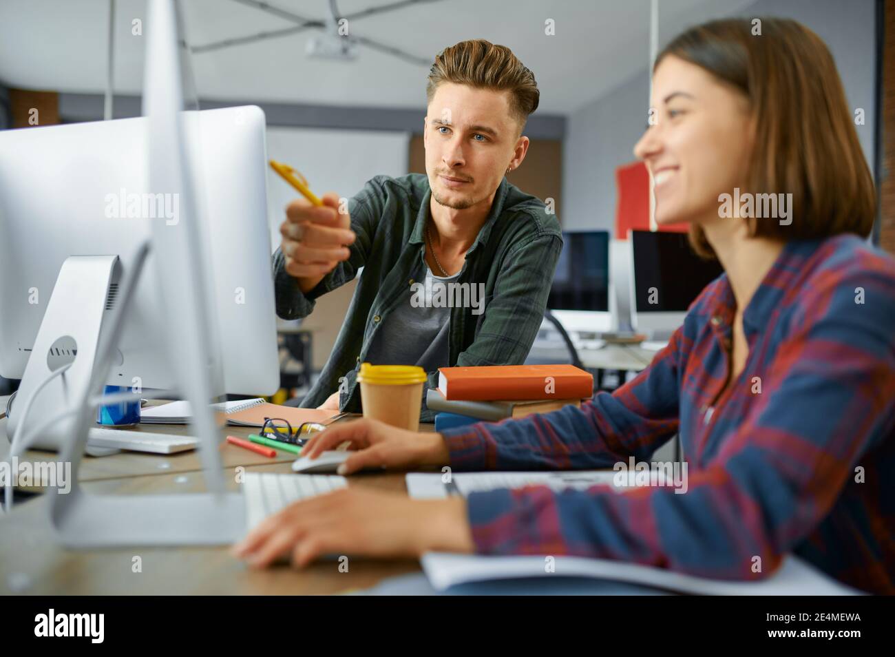 Two IT specialists works on computers in office Stock Photo