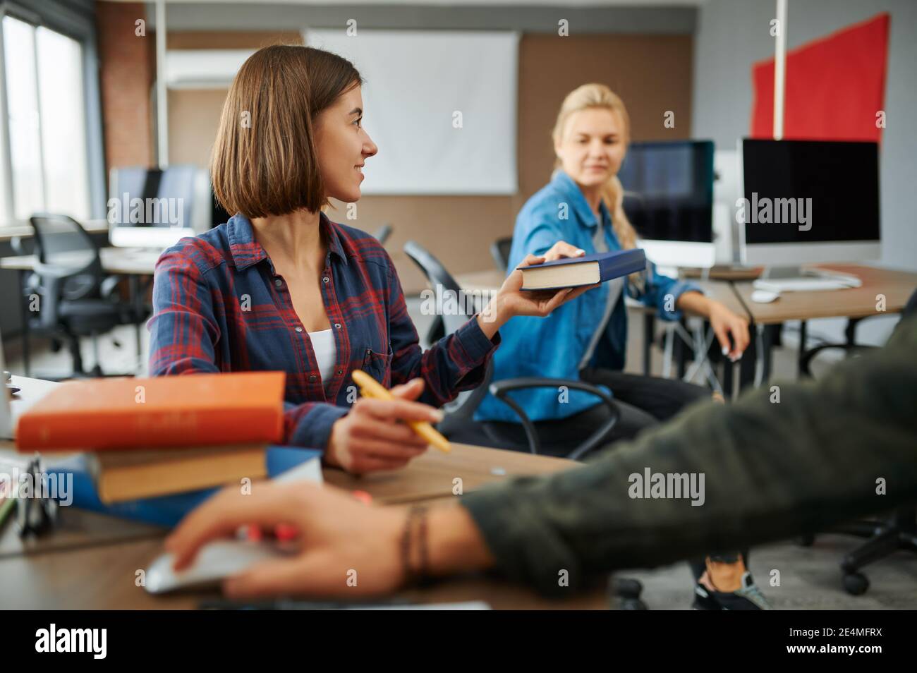 Two female IT specialists works on computers Stock Photo