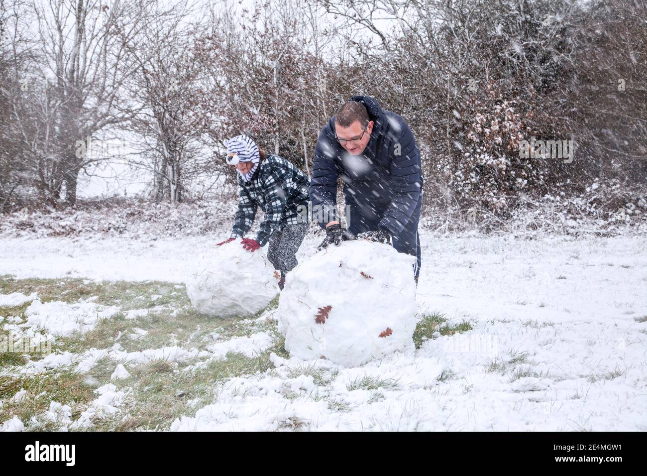 Child Making Snowballs Making a snowball hi-res stock photography and images - Alamy