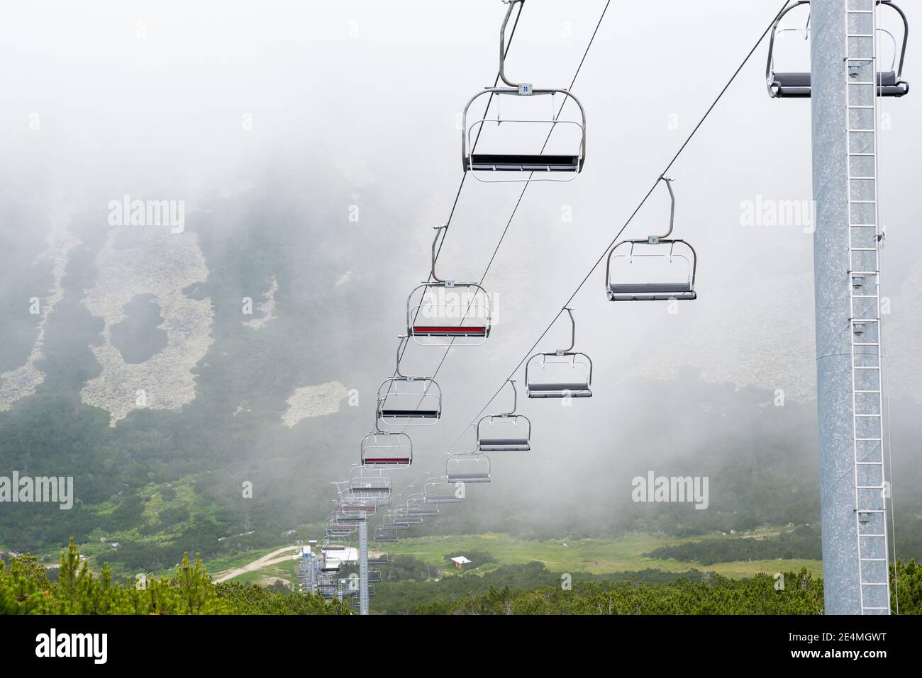 Mountain chairlift. An elevated passenger ropeway. Stock Photo