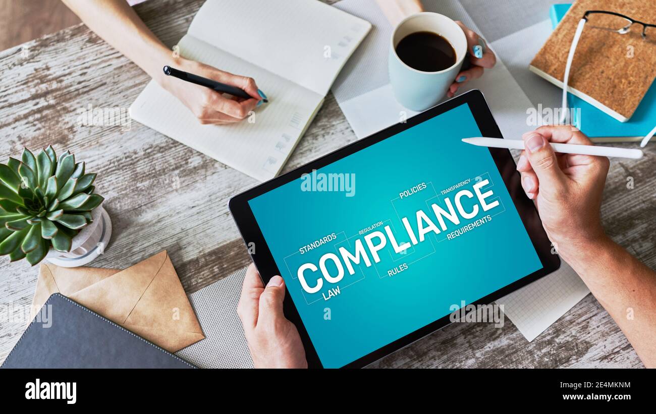 Compliance concept with icons and diagrams. Regulations, law, standards, requirements, audit. Concept on device screen Stock Photo