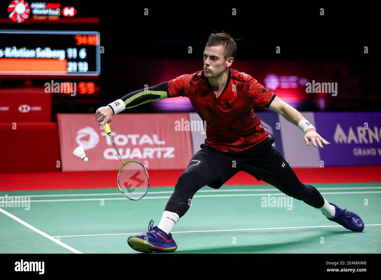 210124) -- BANGKOK, Jan. 24, 2021 (Xinhua) -- Hans-Kristian Vittinghus of  Denmark hits a return during the final of men's singles against his  compatriot Viktor Axelsen at the Thailand Open badminton tournament