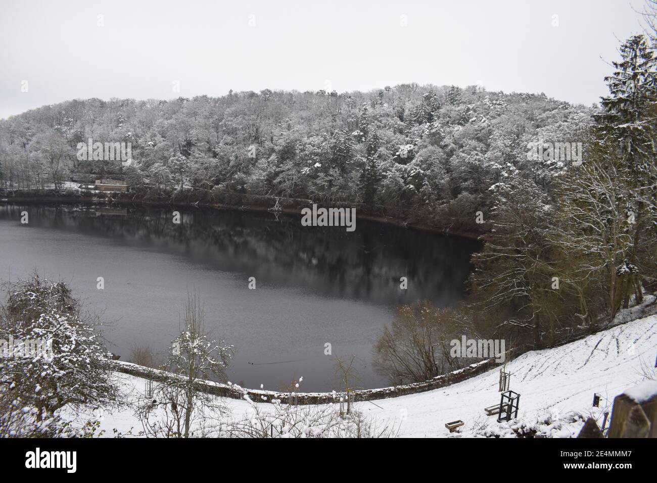 Ulmener Maar in winter with light snow Stock Photo - Alamy