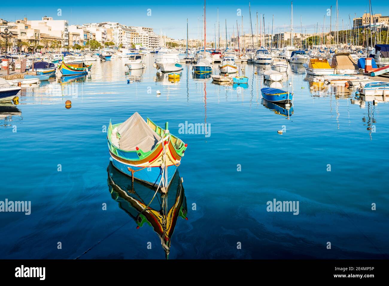 Typical fishing boats in the small port of Sliema on the island of Malta Stock Photo