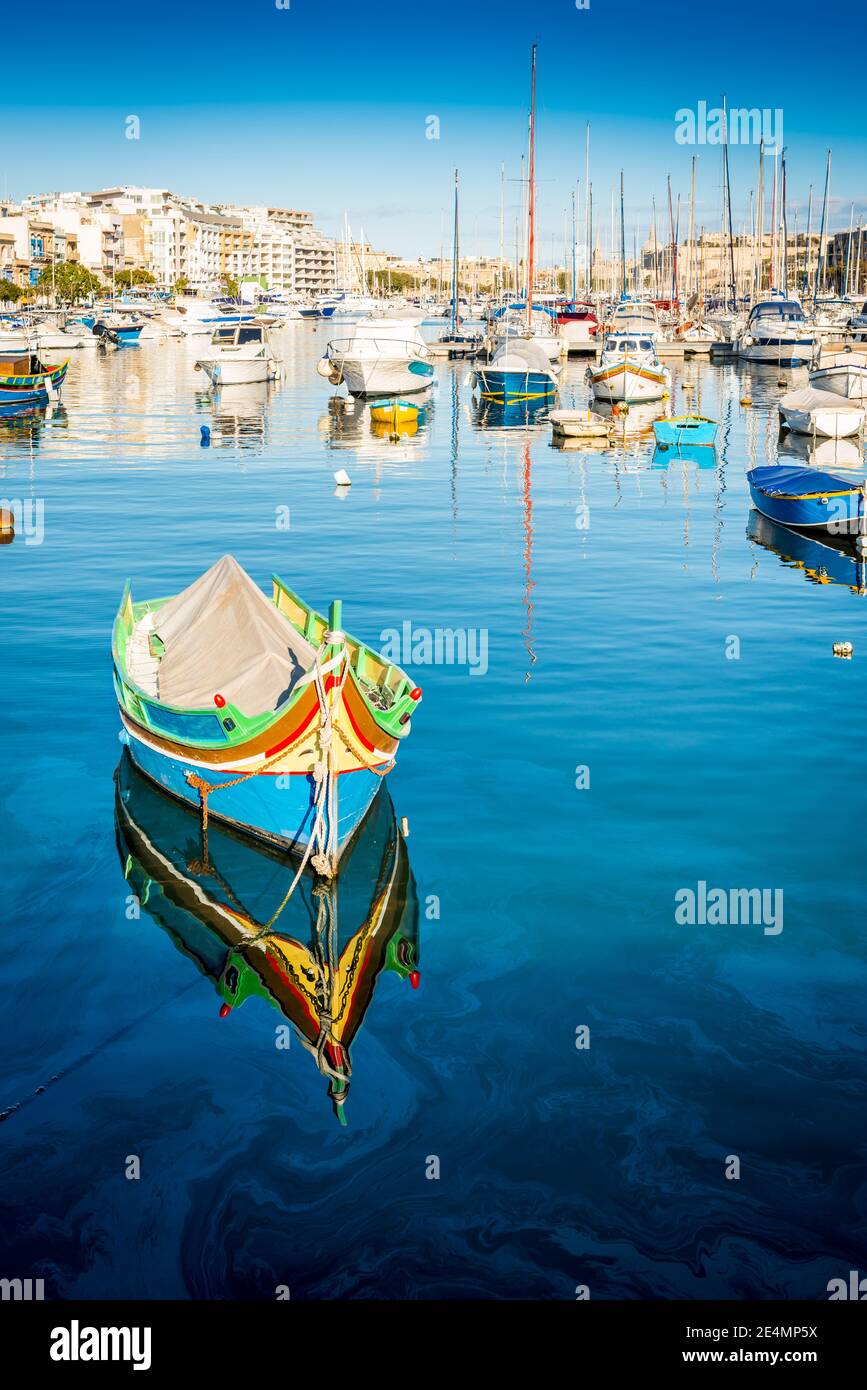 Typical fishing boats in the small port of Sliema on the island of Malta Stock Photo