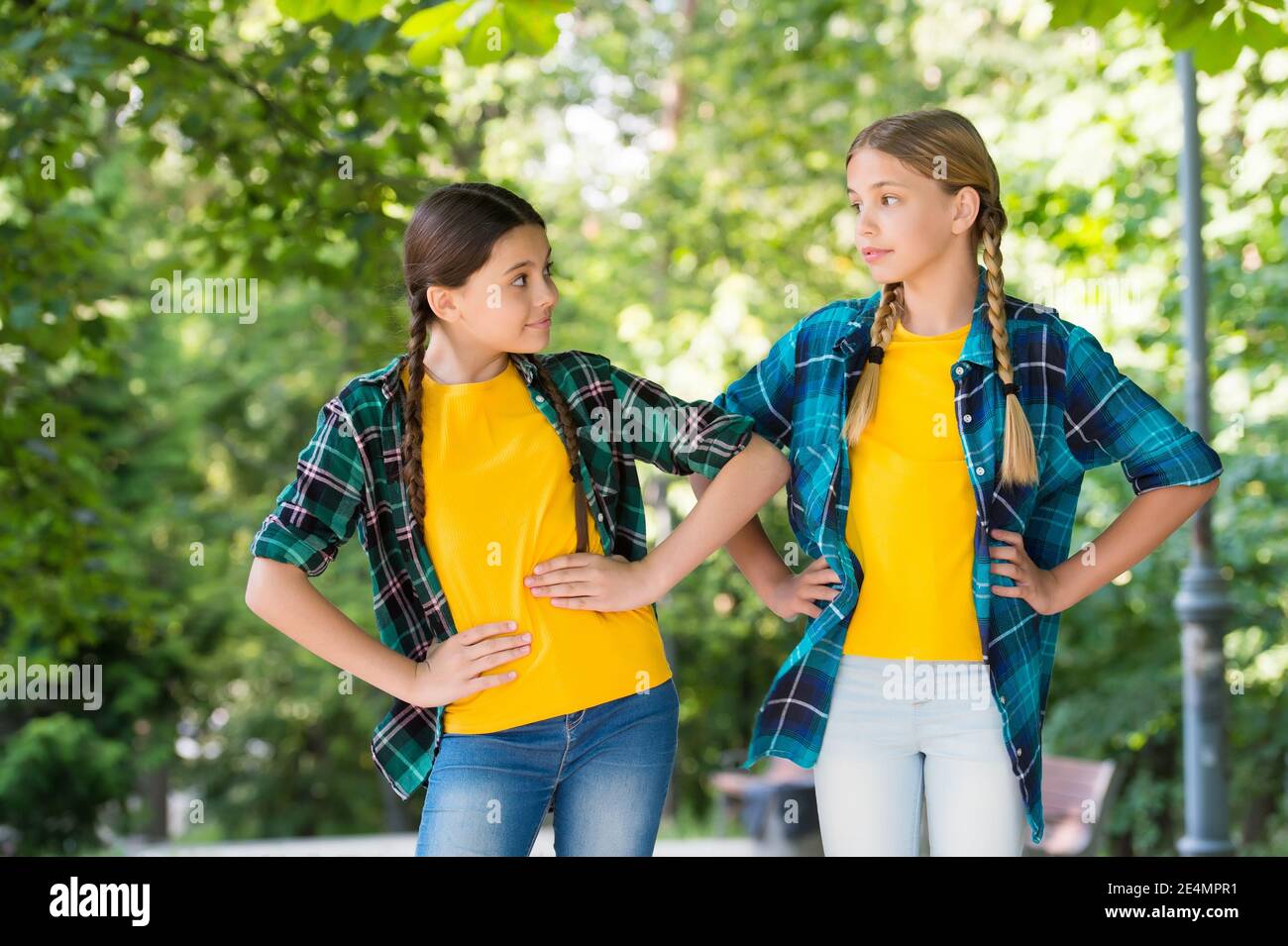 Little children with vogue look pose in casual fashion style summer outdoors, fashionistas. Stock Photo