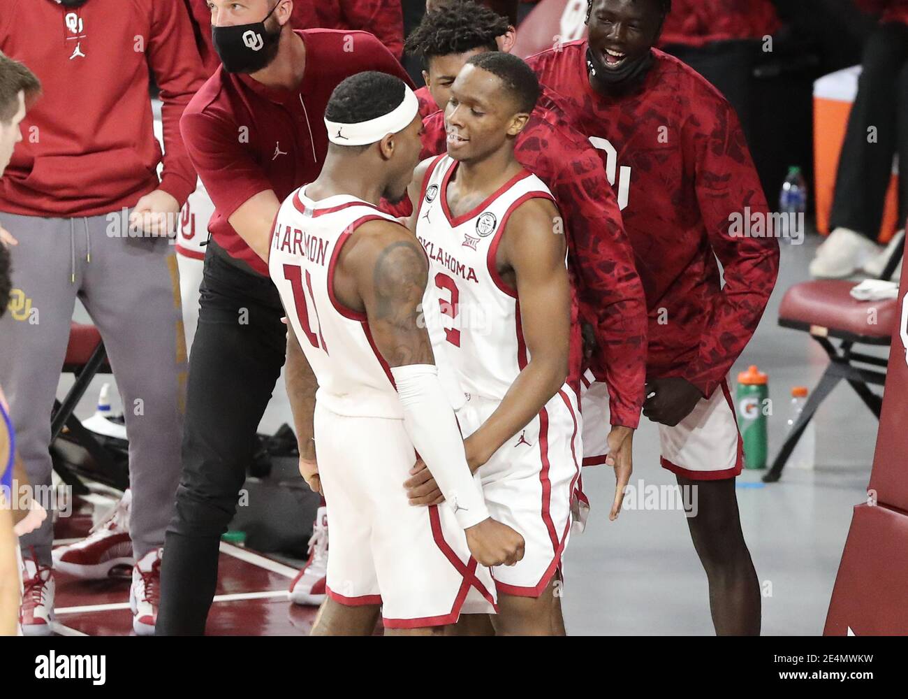 Norman, OK, USA. 23rd Jan, 2021. Oklahoma Sooners guard Umoja Gibson (2) is congratulated by teammate De'Vion Harmon (11) during a basketball game between the Kansas Jayhawks and Oklahoma Sooners at Lloyd Noble Center in Norman, OK. Gray Siegel/CSM/Alamy Live News Stock Photo