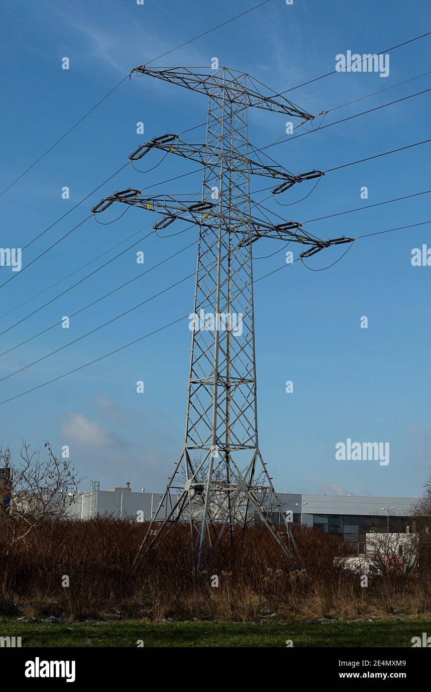 High voltage electrical wires on metal supports. High metal poles with ...