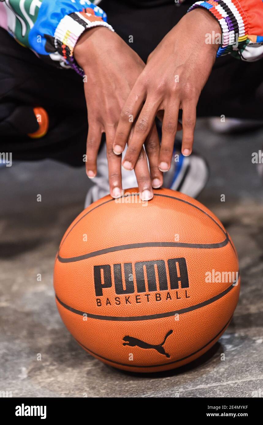 Berlin, Germany. 23rd Jan, 2021. A model touches a basketball with the Puma logo with her hands at the Puma show of the About You Fashion Week at Kraftwerk Berlin. The Berlin Fashion Week for the autumn/winter season 2021/2022 takes place online this time, the shows are shown online because of the pandemic. Credit: Kira Hofmann/dpa-Zentralbild/dpa/Alamy Live News Stock Photo