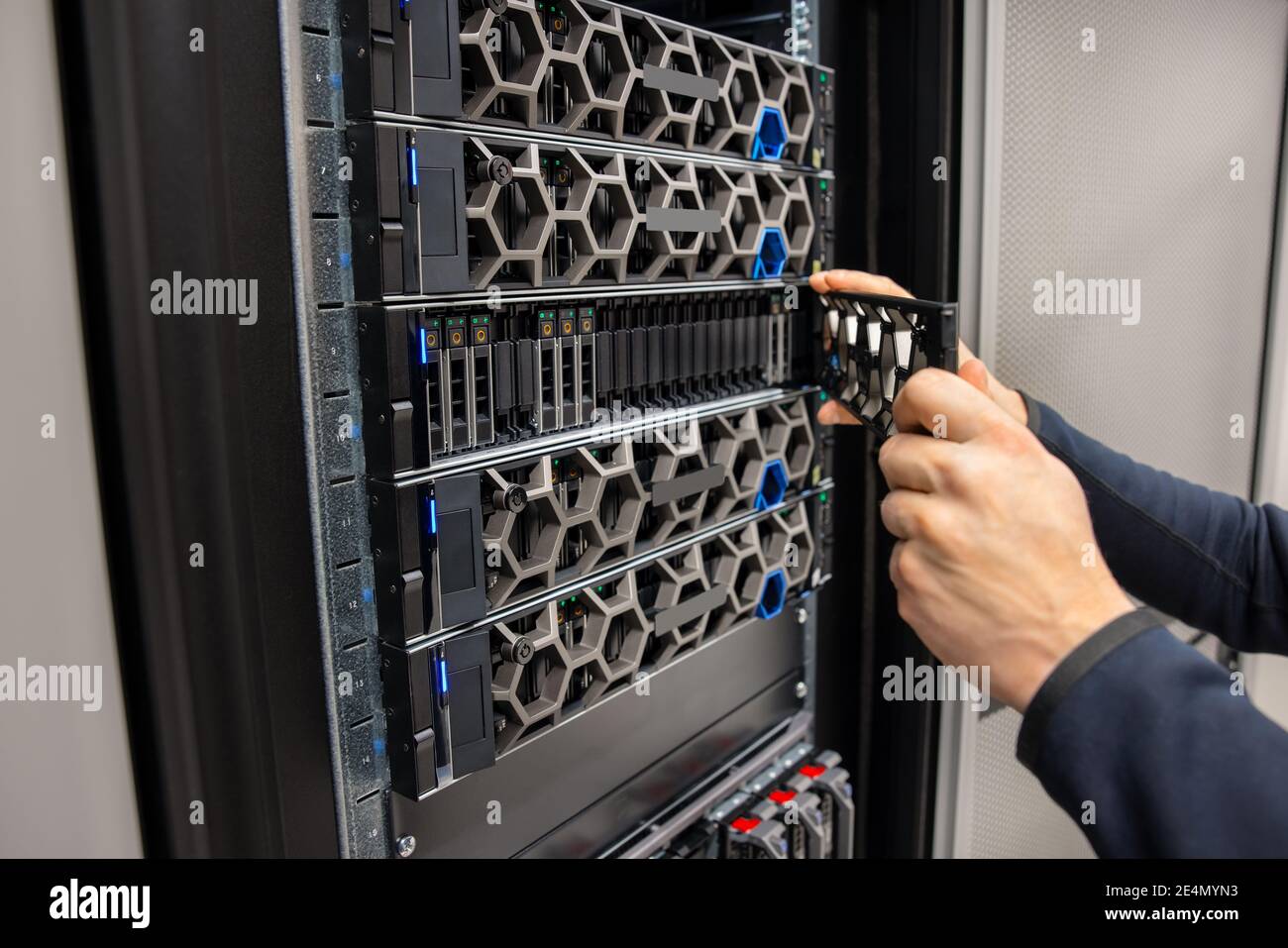 Hands Of Male Technical Consultant Working with Hyperconverged Environment Datacenter Stock Photo