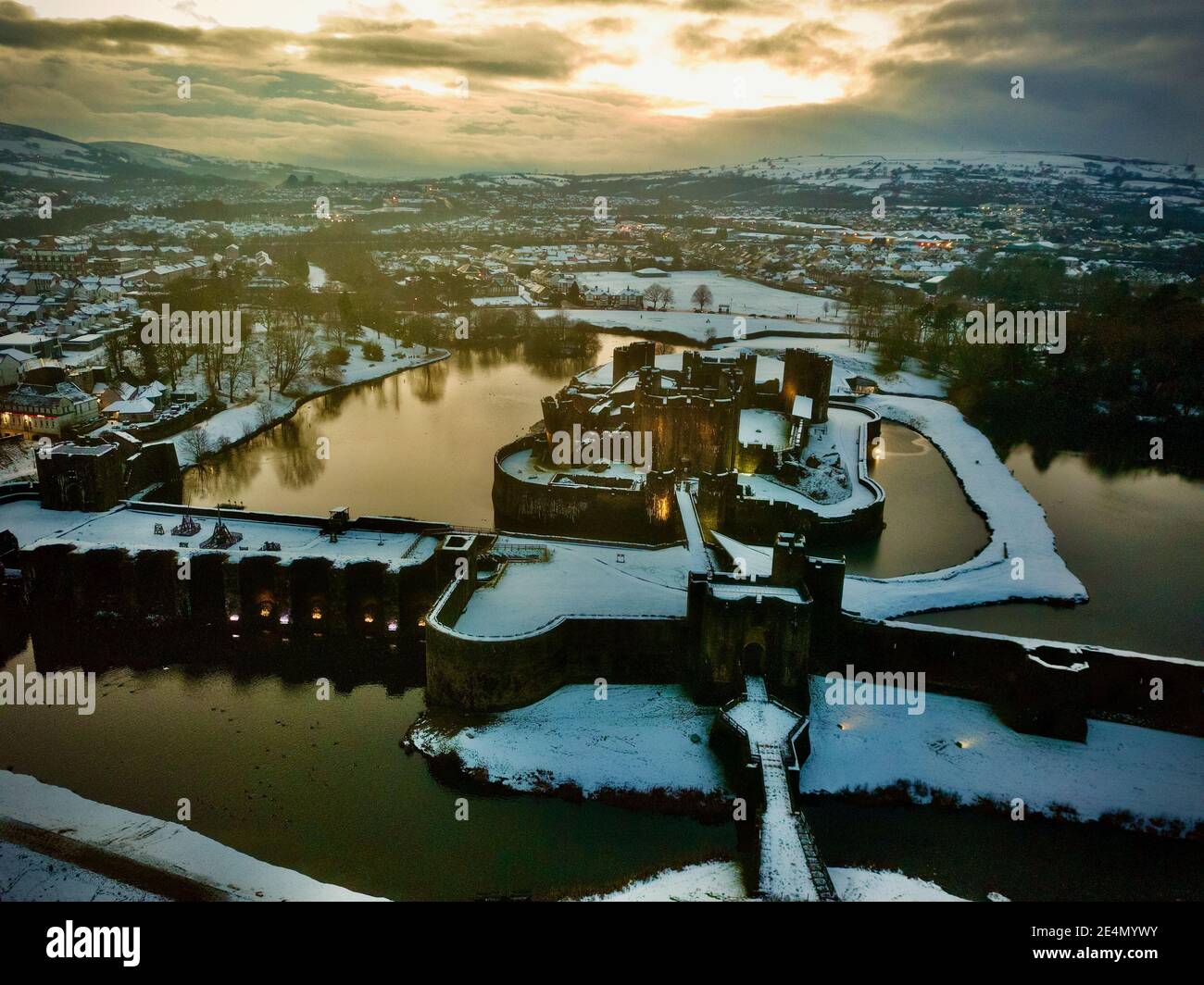 Caerphilly Castle surrounded by snow in South Wales, UK Stock Photo