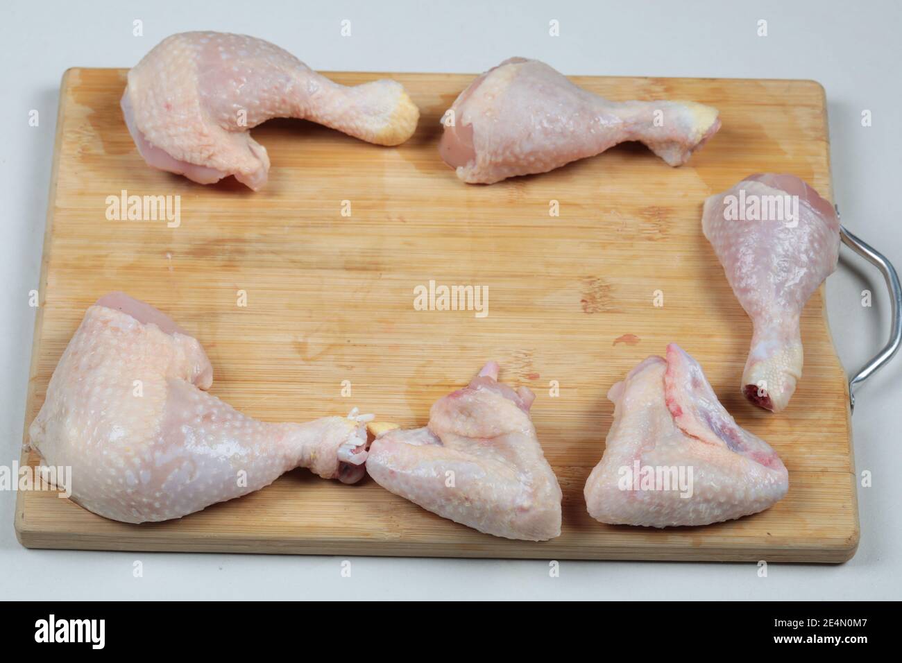 Raw chicken meat parts on wooden chopping board Stock Photo Alamy
