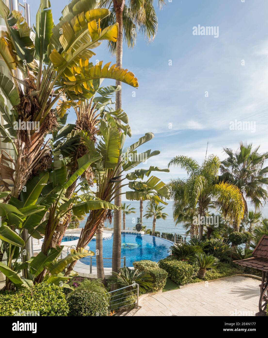 View of swimming pool of apartment block at seaside, Costa del Sol, Malaga, Spain. Stock Photo