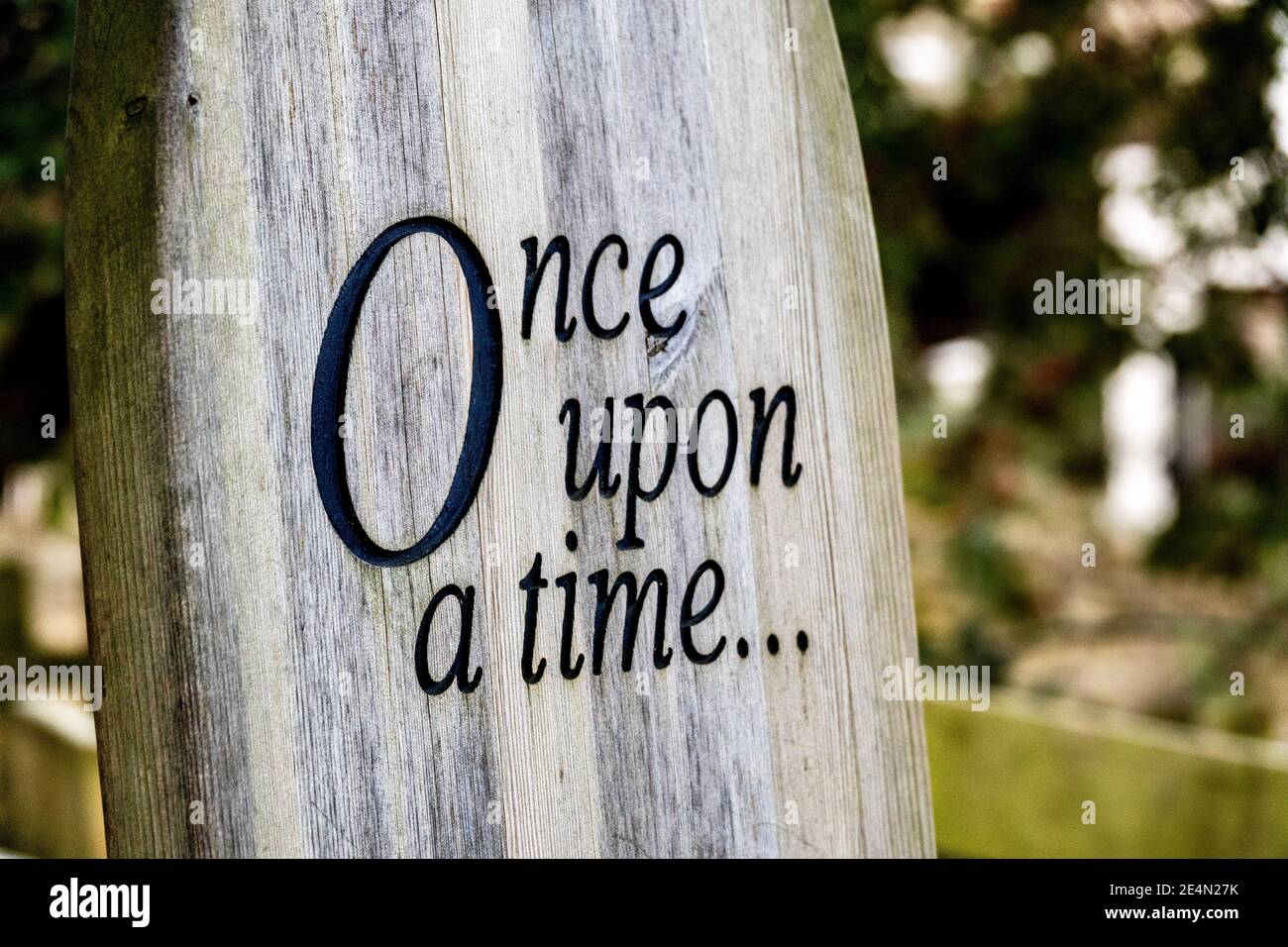 A wooden chair with Once Upon A Time carved into it. Perfect place