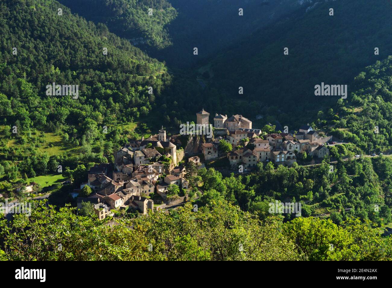 Magnificent mountain landscape in the causses with a view of a village in the Massif Central. Stock Photo