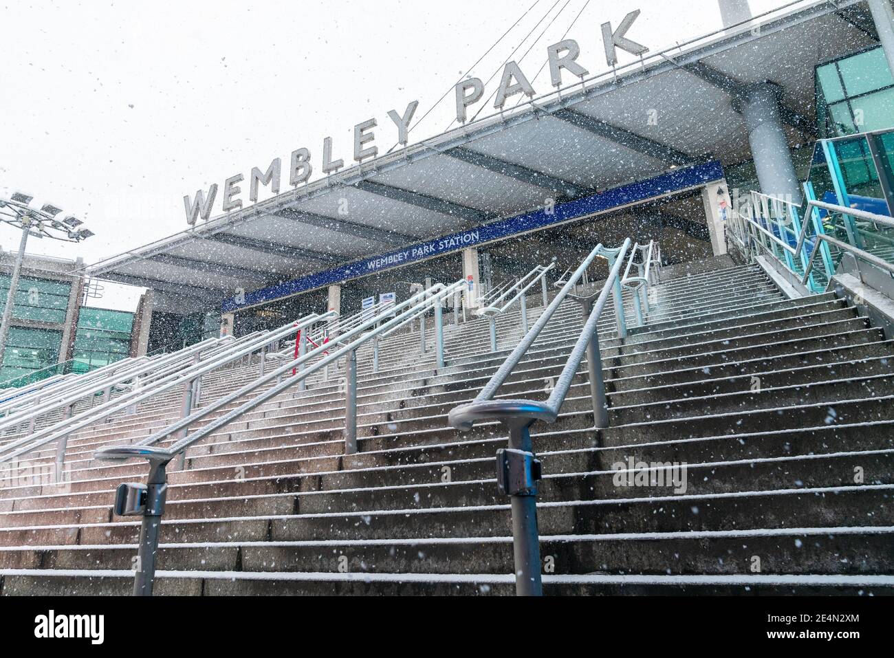 24th Jan 2021 - London, UK. Stairway to Wembley Park Station on a snowy day. Stock Photo