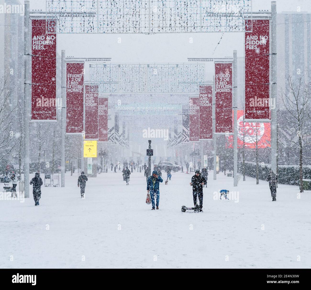 24th Jan 2021 - London, UK. People caught up in heavy snow in Wembley Park. Stock Photo