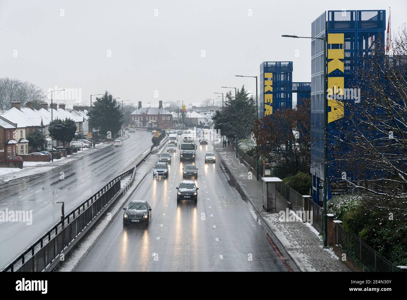 24th Jan 2021 - London, UK. Traffic on a 406 North Circular Road on a wet and snowy day. Stock Photo