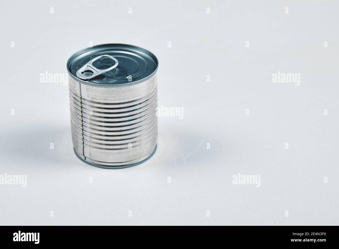 Closed tin can on a white background Stock Photo