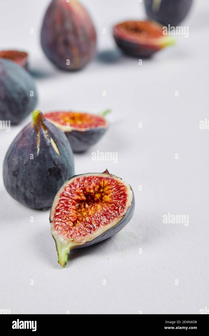Whole fig and fig slices on a white background Stock Photo