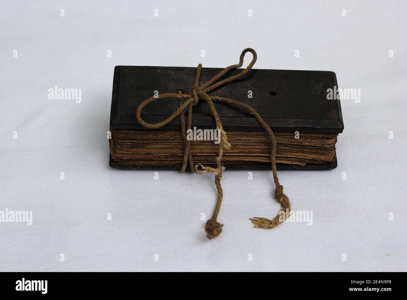 A Palm leaf manuscript book tide with thick rope,palm leaves were used as writing materials in Sri lanka during ancient time Stock Photo