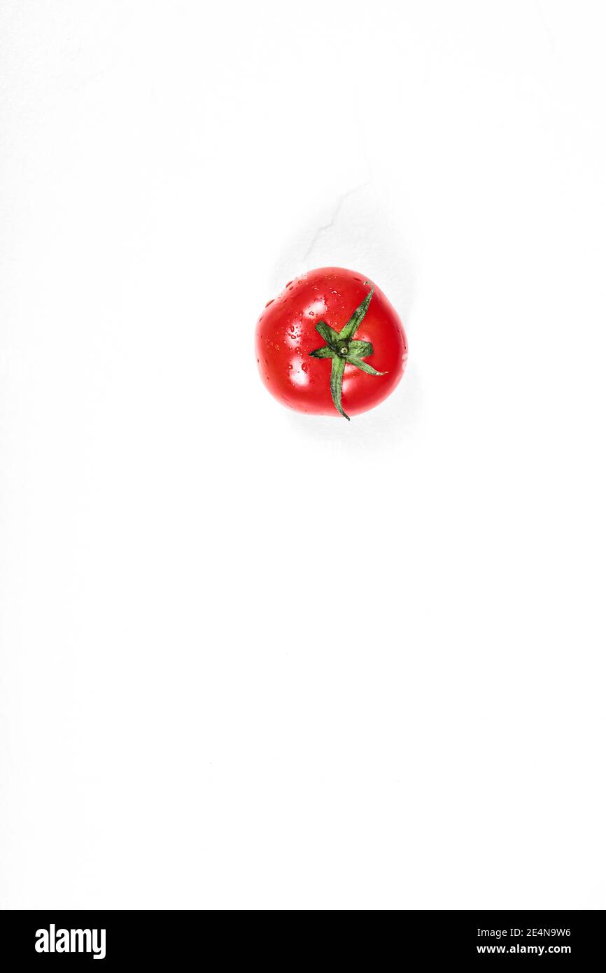 Juicy red tomato isolated on white background Stock Photo - Alamy