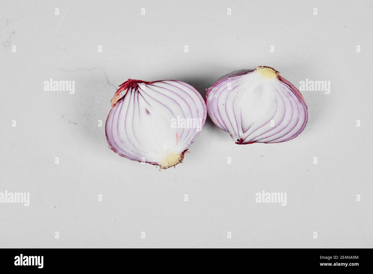 Red sliced onion isolated on white background Stock Photo