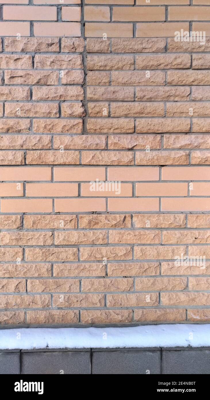 Wall lined with different decorative brick tiles Stock Photo